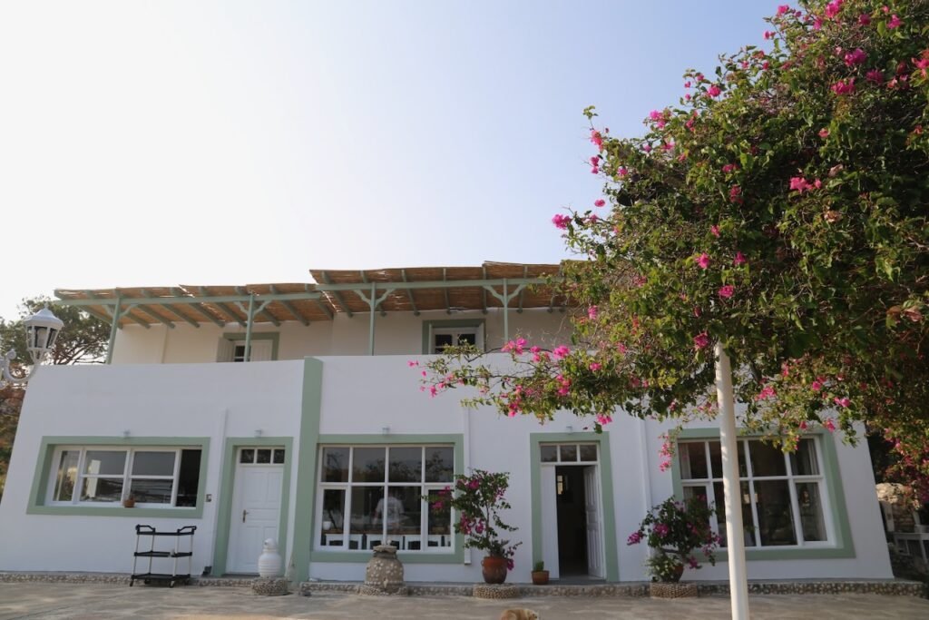 White retreat building with flowers